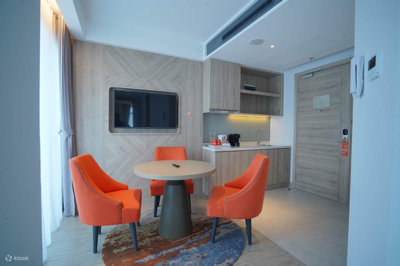 mini living room and kitchen at Harris Suite Puri Mansion