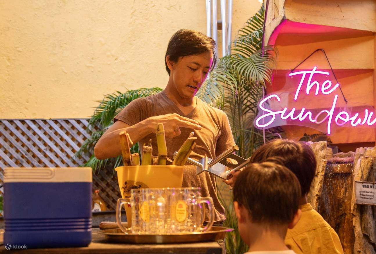 guide teaching children how to make their own sugarcane drink