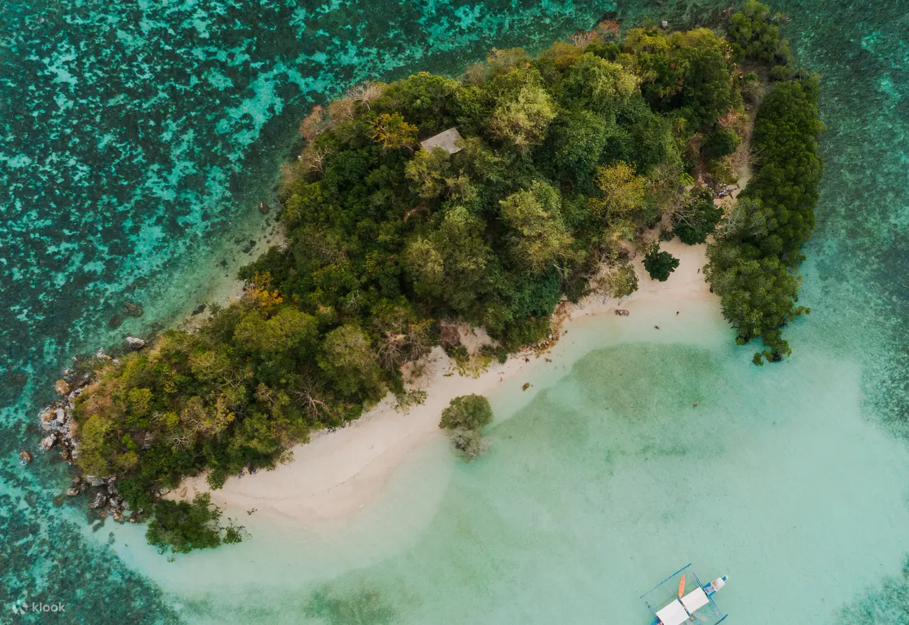 Conclude the day at CYC Beach, a public beach known for its shallow, clear waters and mangrove backdrop. Ideal for light swimming and sunbathing.