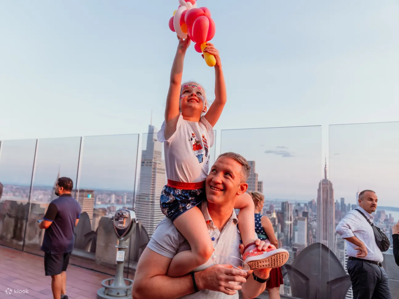 Enjoy cheerful balloon fun with family while exploring iconic Rockefeller Center activities together