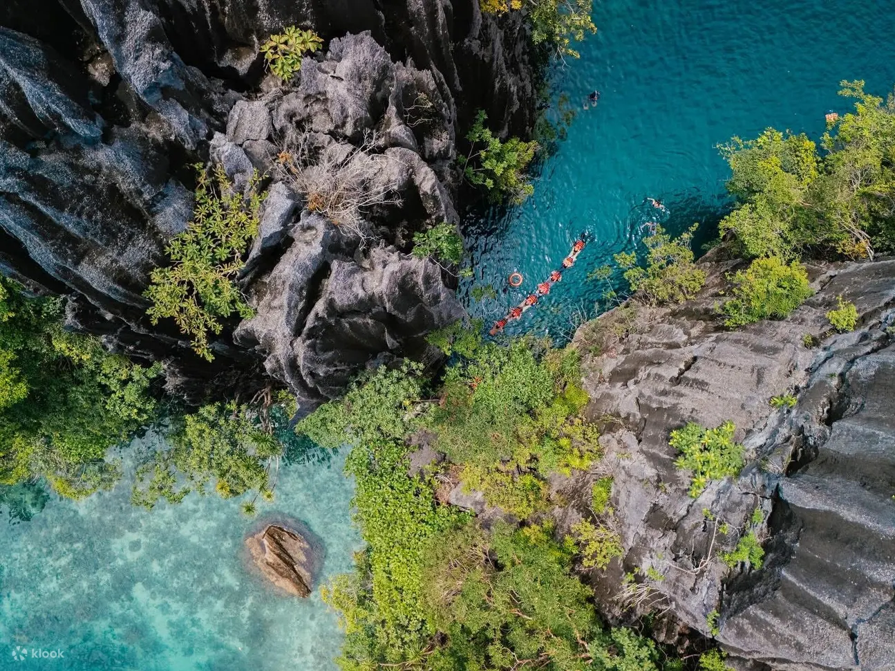 Continue to the iconic Twin Lagoon, where guests will navigate between two stunning lagoons either by swimming under a natural rock archway or crossing a wooden ladder depending on the tide. Experience the thermocline effect created by the mix of salt and