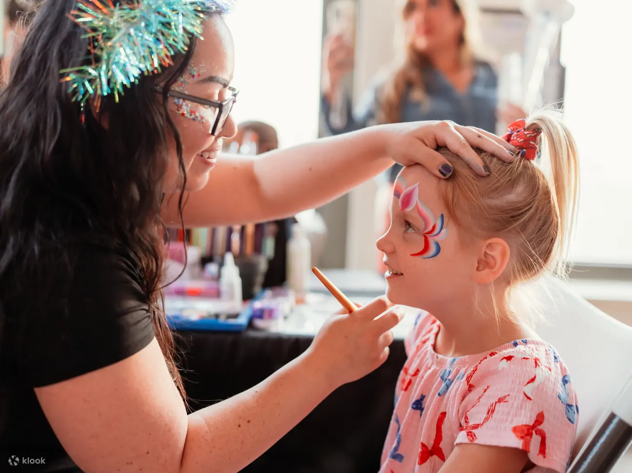 Get colorful face painting designs that bring out smiles and playful city spirit
