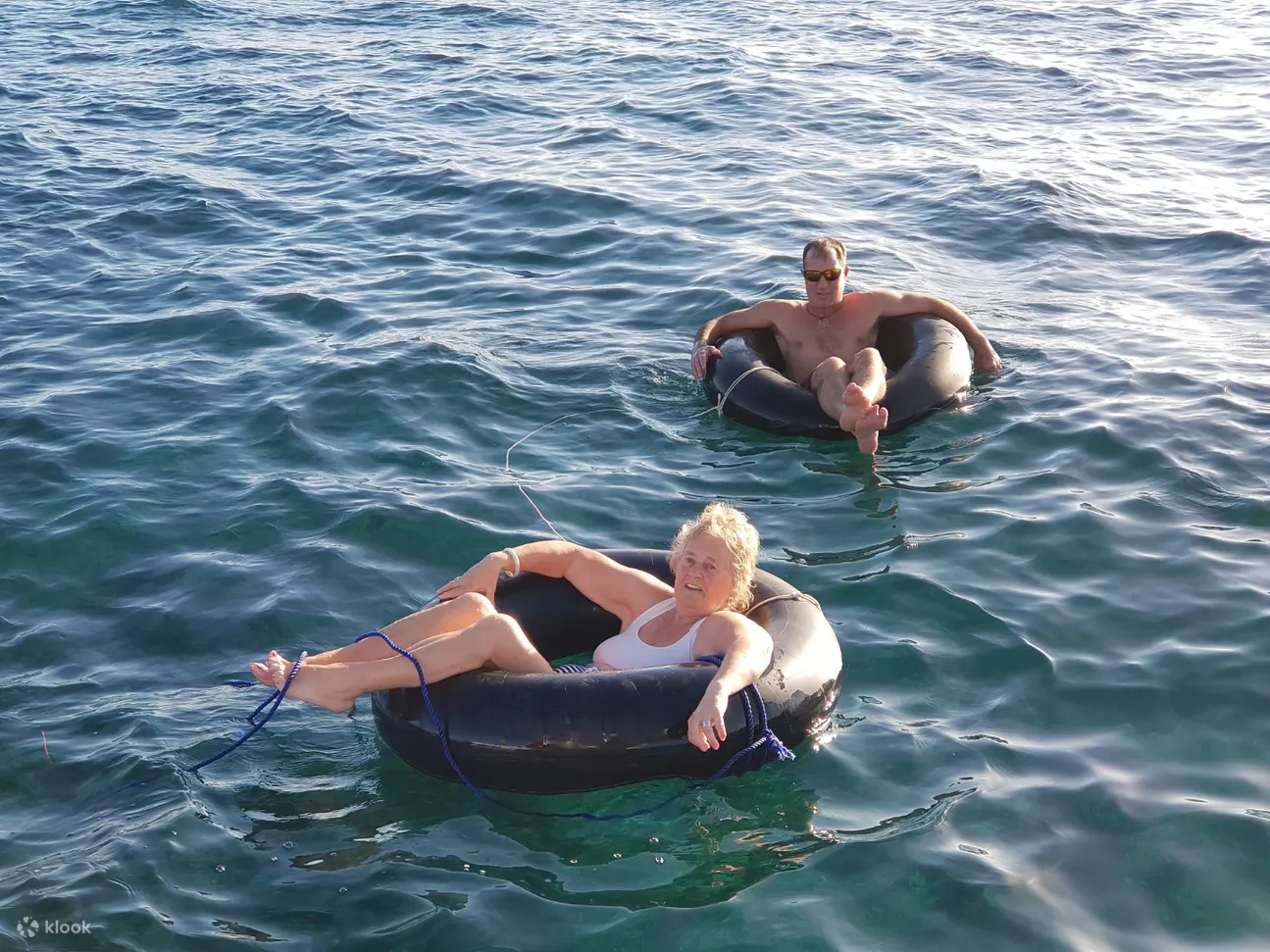 tourists enjoy the sea
