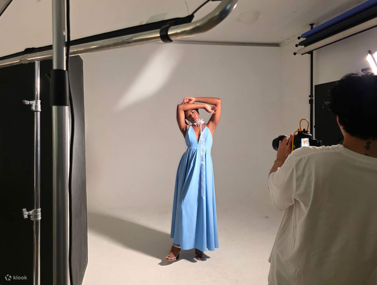 A professional photographer directs me to the poses that suit me best.