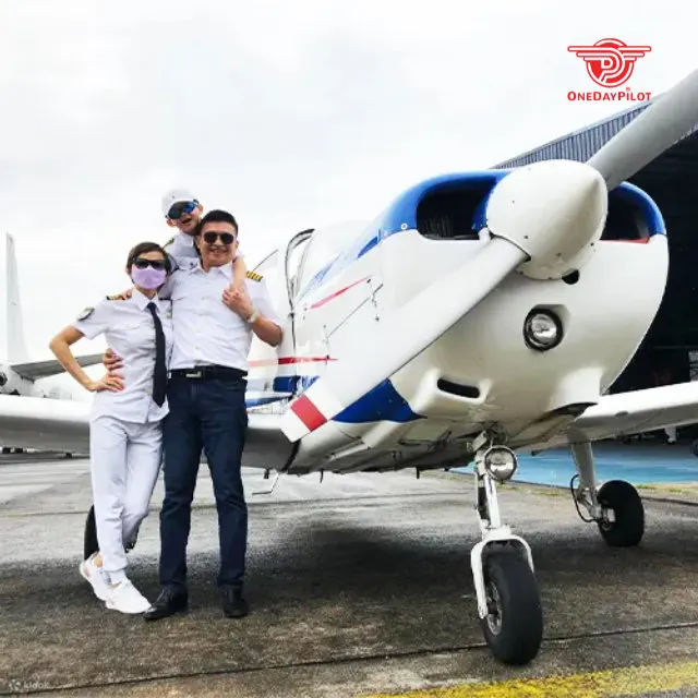 family taking picture with the plane