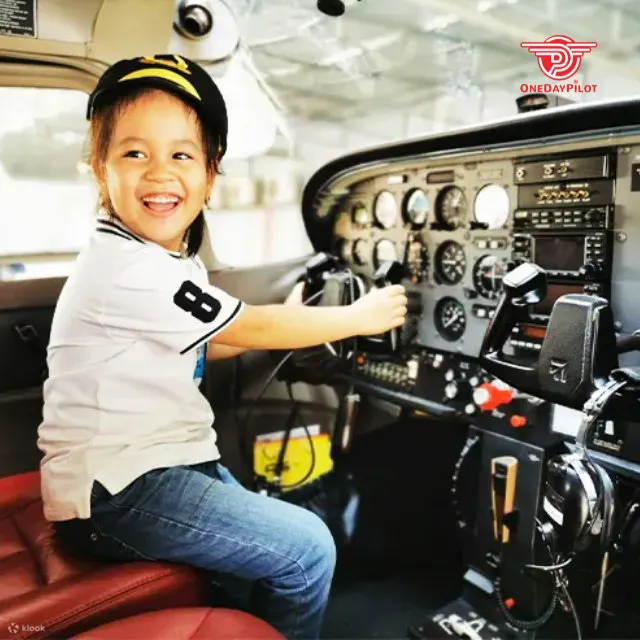 a kid posing driving the plan