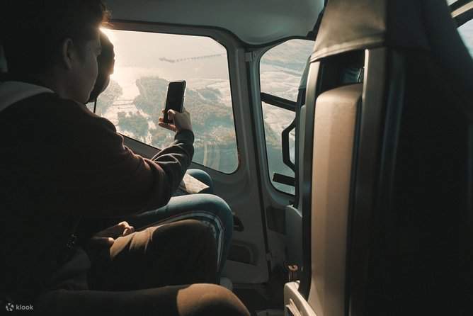 Feel the thrill as you snap a picture from the helicopter, capturing the breathtaking aerial view