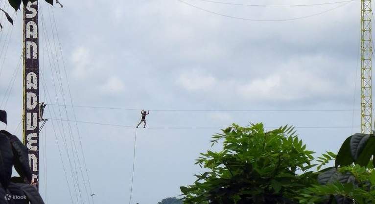 man crossing the twin tower adventure