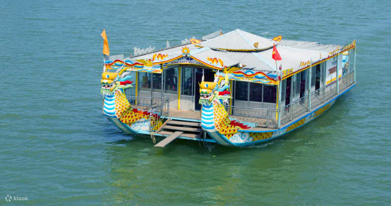 Two boats docked during traditional Hue music show on Huong River