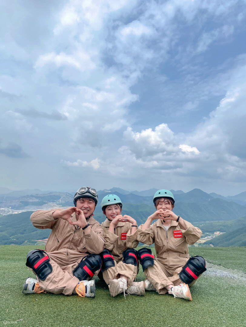 People are smiling at the top of the mountain