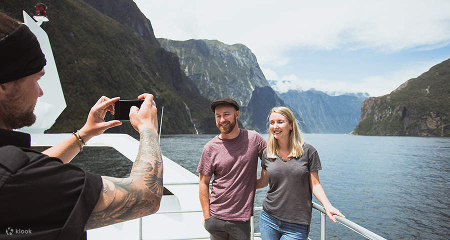 someone taking a picture of a couple during the cruise