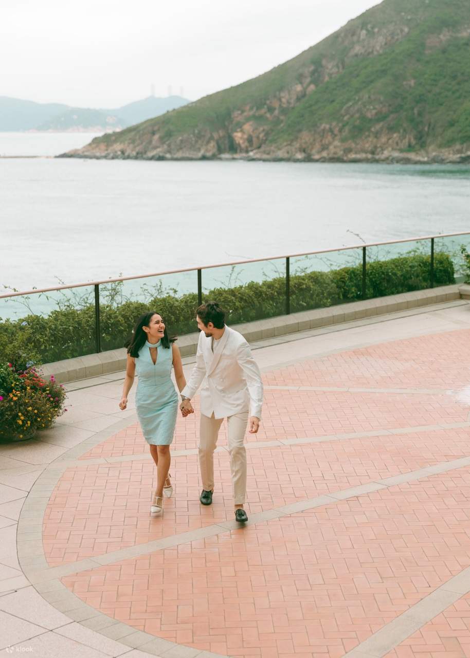 Capture breathtaking moments against the stunning backdrop, where majestic mountains meet the sparkling sea, creating a perfect setting for your romantic photoshoot.
